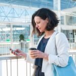 bona-vitalis-Executive-browsing-health-screening-packages-on-phone